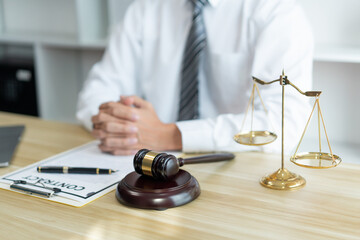 Law consultancy concept A male lawyer concentrating on the contract paper and trying to figure it out accurately.