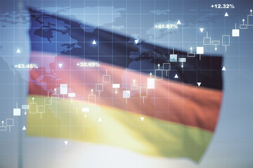 Abstract creative financial graph interface and world map on flag of Germany and sunset sky...