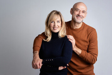 Happy mature couple studio portrait - Powered by Adobe