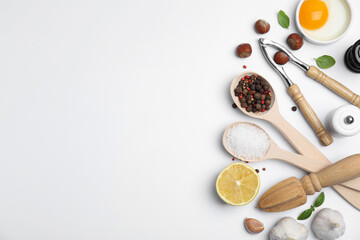Composition with cooking utensils and fresh ingredients on white background, top view. Space for text