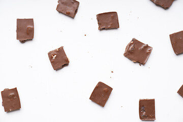 milk chocolate with hazelnuts and raisins is isolated on a white background. cooking concept