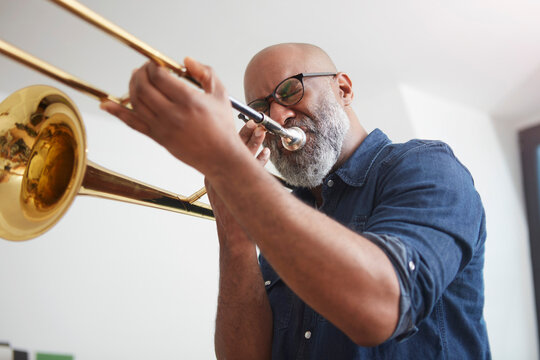 Portrait of man playing trombone