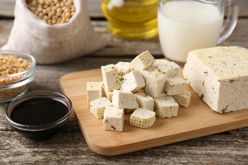 Different natural soy products on wooden table, closeup