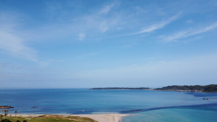 Fototapeta na wymiar 角島大橋　ドローン空撮空からの眺め　角島と青い空とエメラルドグリーンとブルーの海