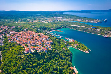 Town of Omisalj rooftops and bay aerial view