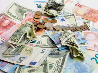 Cash on table isolated: dollars, euro, rubl broken money. All in mess, global crisis concept, dollar rules world