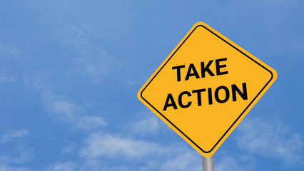 Take Action Road Sign on Clear Blue Sky