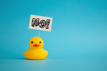 Rubber duck carries a signboard with the word no. Political activism and voting