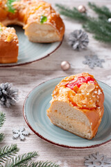 Three kings day cake or bread on rustic background, top view