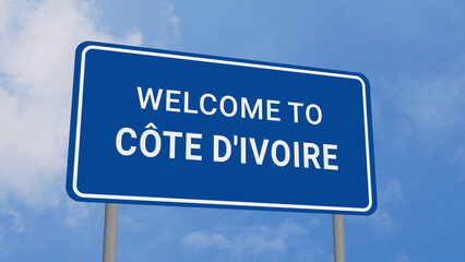 Obraz premium Welcome to Cote D'Ivoire Road Sign on Clear Blue Sky