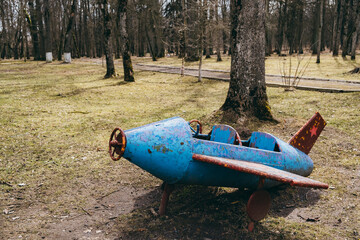 Retro plane on the playground of the times of the USSR. Vintage object for children games of Soviet preschoolers. Equipment and simulators of game activity. Childhood memories. History. Circa 1960