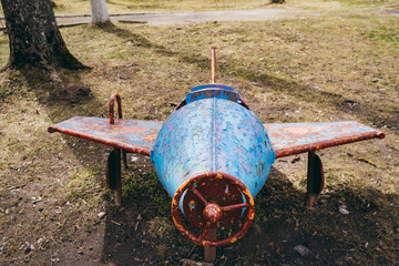 Retro plane on the playground of the times of the USSR. Vintage object for children games of Soviet preschoolers. Equipment and simulators of game activity. Childhood memories. History. Circa 1960