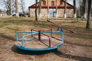Fototapeta na wymiar Retro swings on the playground of the times of the USSR. Vintage objects for children games of Soviet preschoolers. Equipment and simulators of game activity. Childhood memories. History. Circa 1960