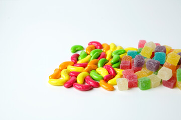 Colorful mix sugar and sweet jelly candy on white background, kids and adult should eat in moderation                            