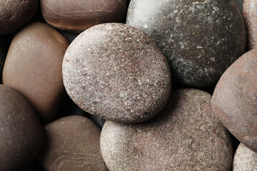 Fototapeta na wymiar Many different stones as background, top view