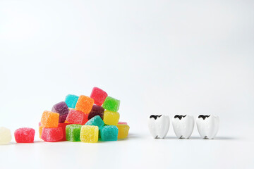 Decay and cavity teeth look at heap of colorful sweet jelly candy, eating too much sugar can cause...