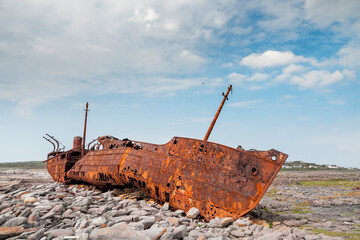 Plassey shipwreck on shore of Inisheer island. Aran islands, county Galway, Ireland. Rough stone...