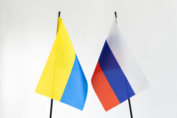 State flag of Russia and Ukraine on white background. Russian Ukrainian war conflict concept