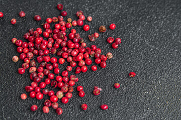pink peppercorn allspice pepper  spice meal food on the table copy space food background rustic top...