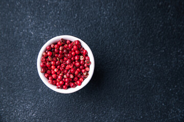 pink peppercorn allspice pepper  spice meal food on the table copy space food background rustic top view