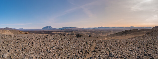 Panoramic view over Icelandic landscape near colorful volcanic caldera Askja, in the middle of volcanic desert in Highlands, blue sunset sky, Iceland. © neurobite