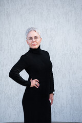 Portrait of beautiful senior woman with white hair and eyewear outdoor