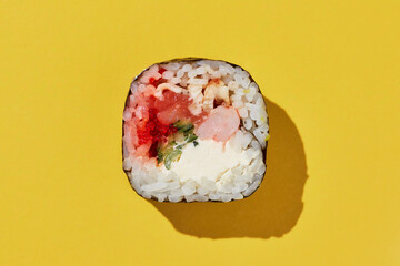 Fresh maki sushi roll on yellow background. - 500882161