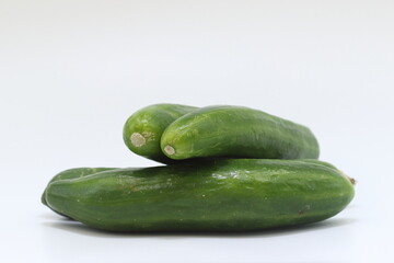 Cucumbers presented on a white background
