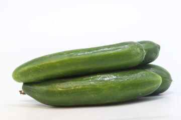 Cucumbers presented on a white background