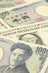 Close-up of various denominations of Japanese Yen and US Dollar banknotes