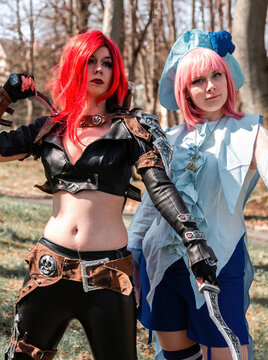 two women as cosplay figures in a forest