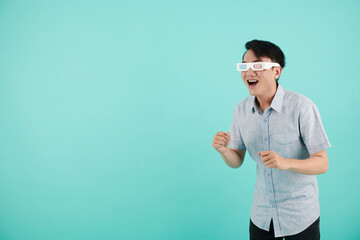 Excited young man watching movie with 3D effects in anaglyph paper glasses