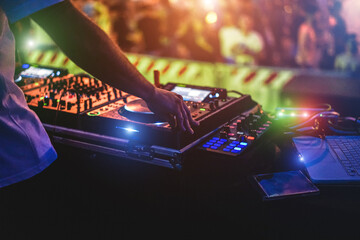 Dj mixing outdoor at summer party event - Entertainment and festival concept - Soft focus on hand