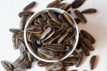 Sunflower seeds toasted in a blue bucket