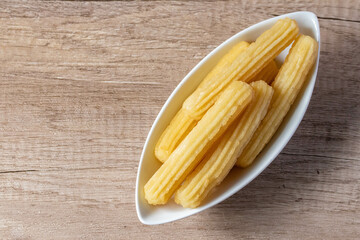 churros sticks typical of Spain with charcoal and vanilla