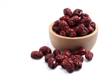 Dried Chinese jujube in a cup on white background. Isolated image.