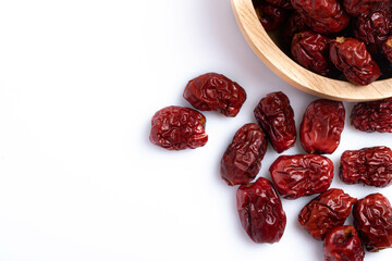 Dried Chinese jujube in a cup on white background. Isolated image.