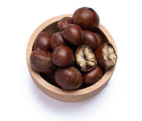 chestnuts in a wooden cup on a white background