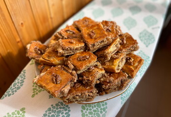 Baklava combines honey-soaked layers of flaky phyllo pastry with spiced walnuts. It’s a great make-ahead dessert perfect for the holidays or special occasions