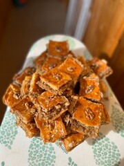 Baklava is a delicious traditional dessert made of layers of crispy golden brown phyllo, filled with chopped walnuts and garnished with honey syrup. Delicious dessert of pakhlava 