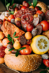 Delicious edible bouquet of sausage, tomatoes, cheese. Gift for man.