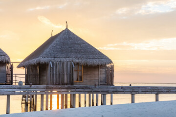 Resort in Maldives. Water villas along wooden jetty