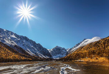 Autumn in the valley of the Akturu river at the foot of the glaciers of the North Chui range....