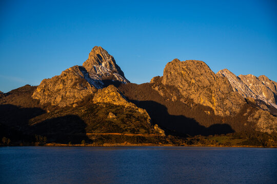Sunrise over mountains at Ria&ntilde;o reservoir in Spain