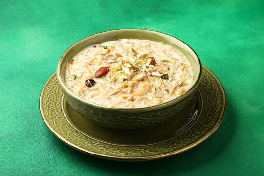 Khir or kheer payasam also known as Sheer Khurma Seviyan consumed especially on Eid or any other festival in india/asia. Served with dry fruits toppings selective focus 