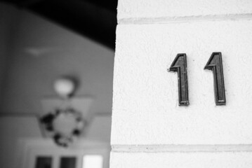 Number eleven on the wall. Sign on the wall.
