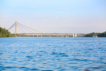 Banner with a beautiful cityscape, a view of the river and the bridge. Summer. Europe, Kyiv. Skyline. Travel concept.