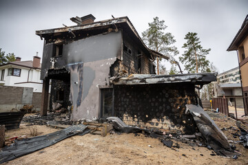 Fototapeta na wymiar Hostomel, Kyev region Ukraine - 09.04.2022: Cities of Ukraine after the Russian occupation. Houses that burned down after being hit by rockets, mines. Irpin, Bucha, Gostomel.