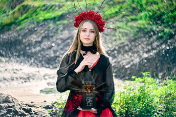 girl teenager princess with a crown in a red dress.