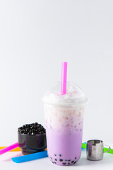 Traditional beverage of asia taiwan,  Ice buble or boba milk tea in plastic cup with straw on white...